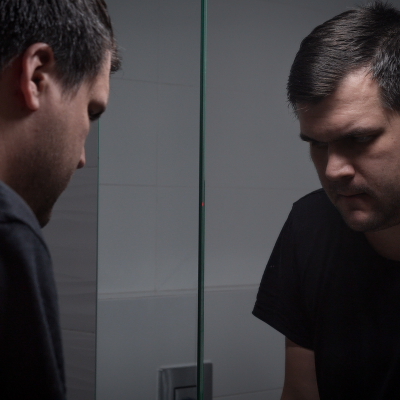 Person reflecting on fitness progress while planning a new workout routine