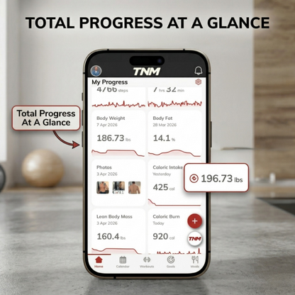 An iPhone displaying the TNM 'TOTAL PROGRESS AT A GLANCE' app dashboard on a marble surface in a home gym setting. The screen shows user 'My Progress' with graphical summaries for steps, sleep, body weight, body fat percentage, and progress photos. Callout arrows point to weight trend charts and specific values, with a large pill callout that says 'Total Progress At A Glance'.